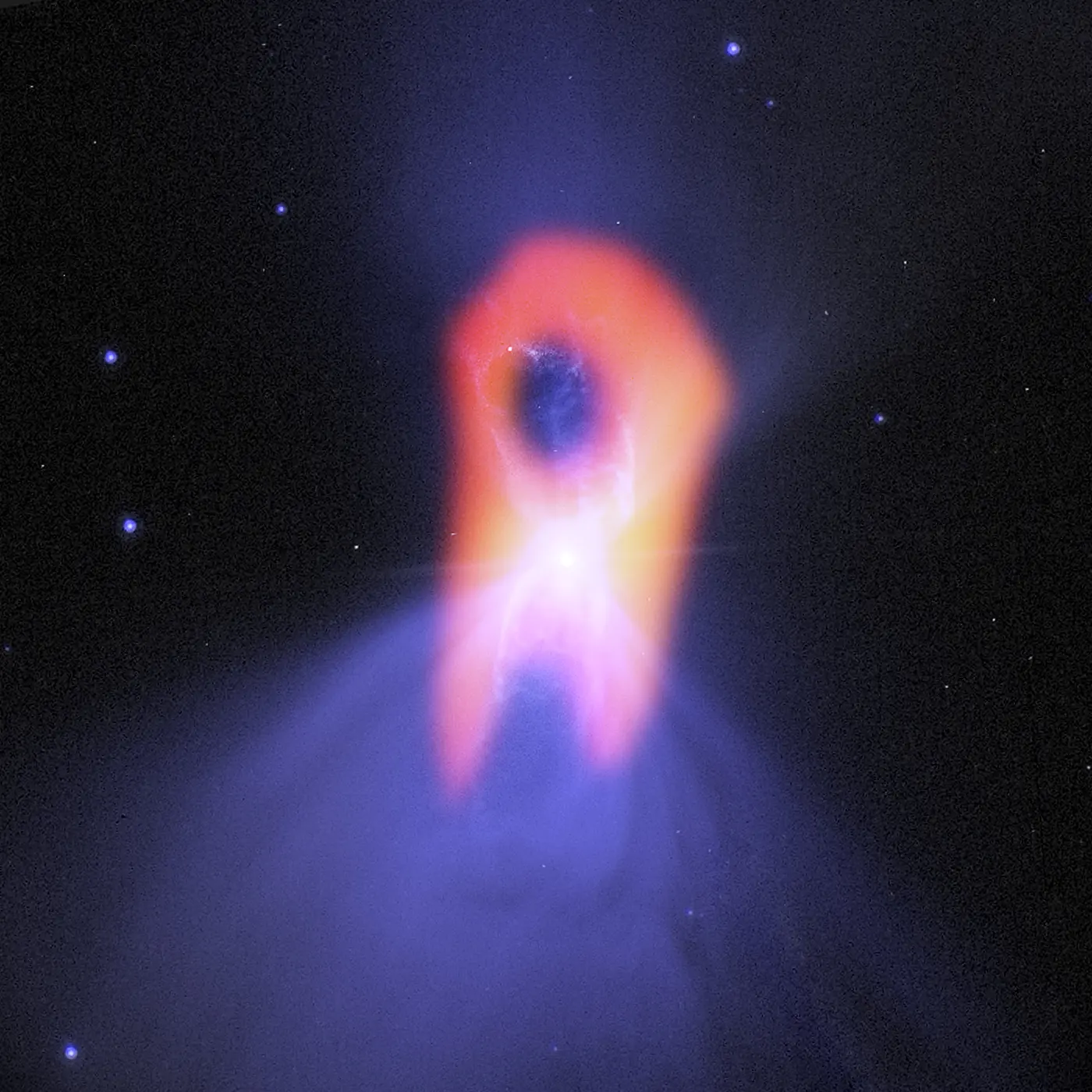 Red glowing gas stretching vertically from the center of a hazy blue-violet nebula