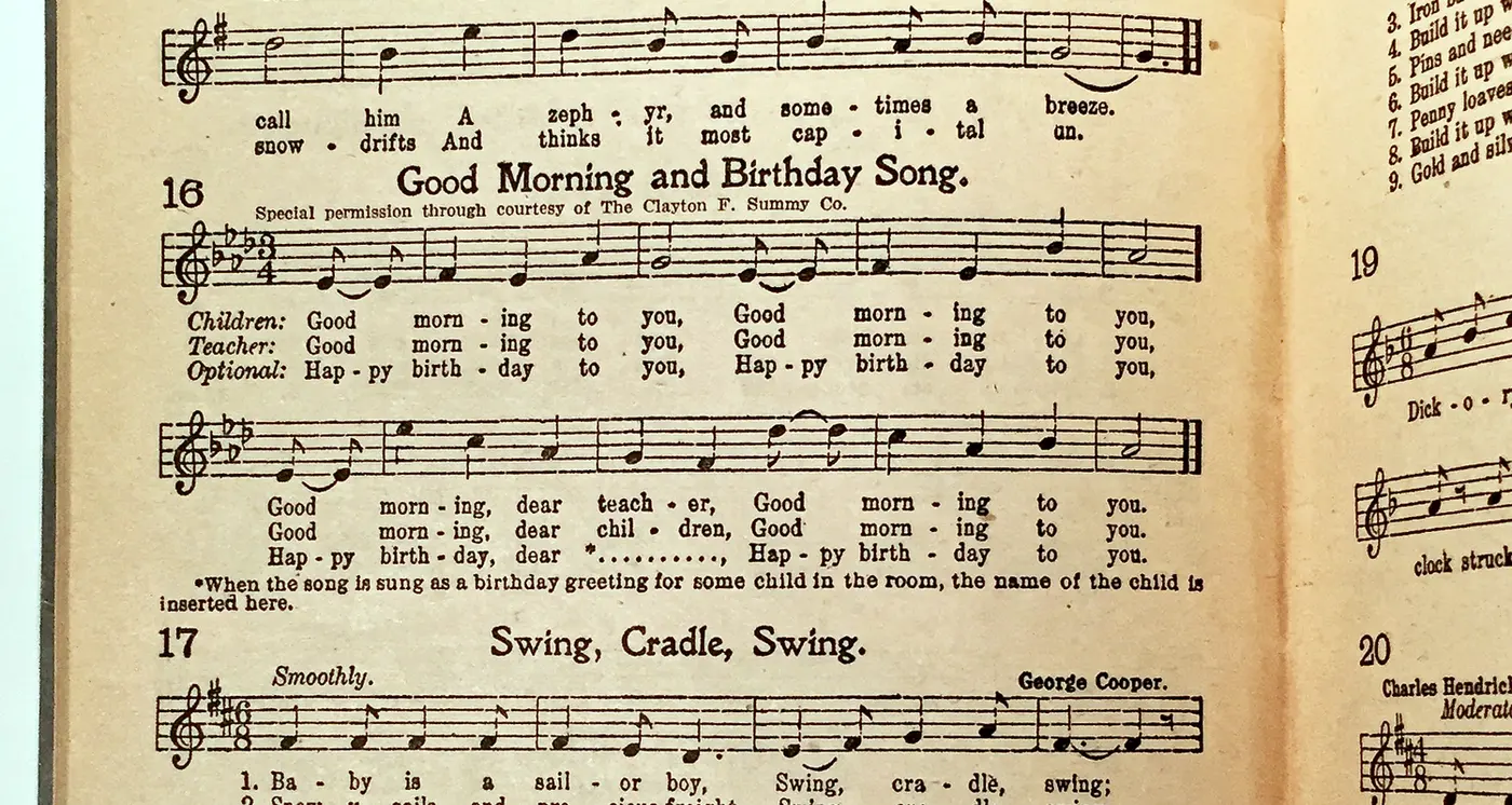 Sheet music for a morning greeting and birthday song printed in an old songbook