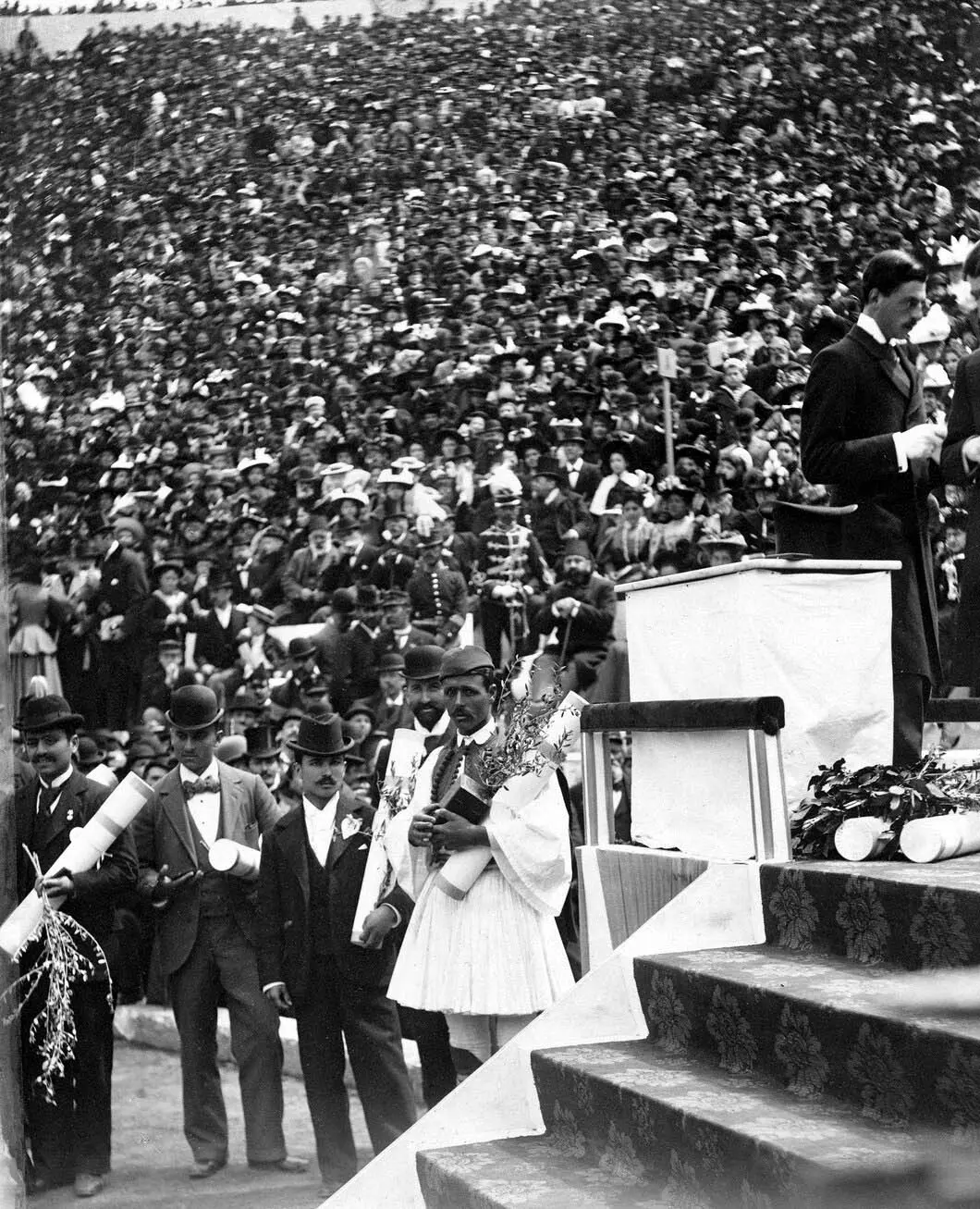 Photo of Spyridon Louis, winner of the 1896 Athens Olympic marathon, standing in traditional dress