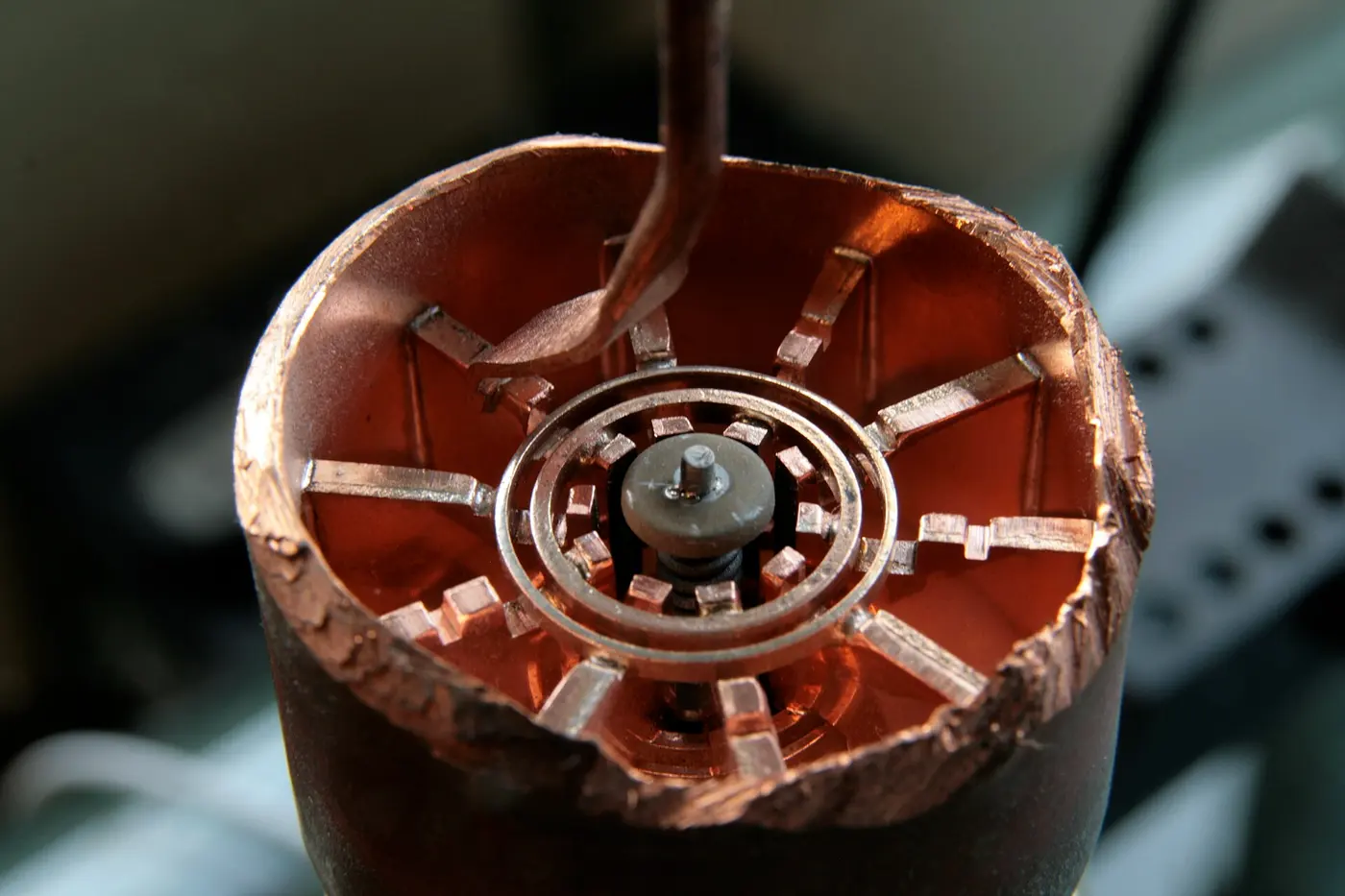 A cross-section of a microwave oven magnetron, with radially divided copper parts surrounding a central electrode