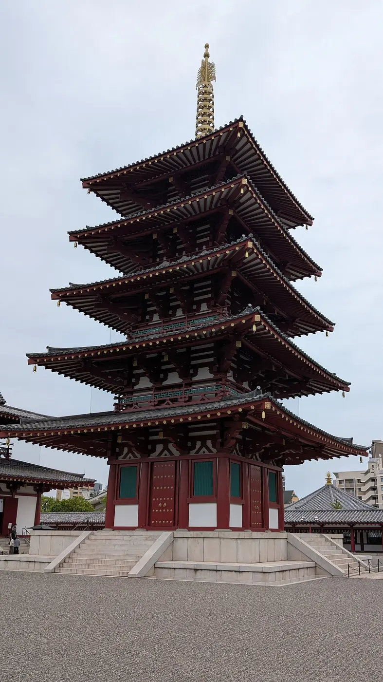 The five-story pagoda of Shitennō-ji, with layered tiled roofs, vermilion pillars and white walls