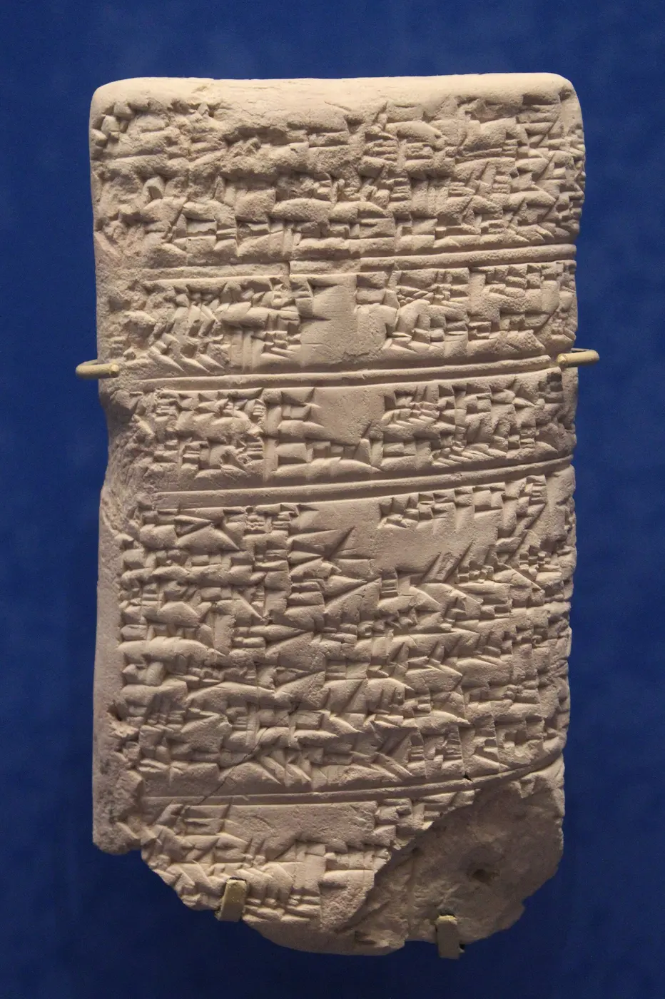 A clay tablet densely covered in fine cuneiform script