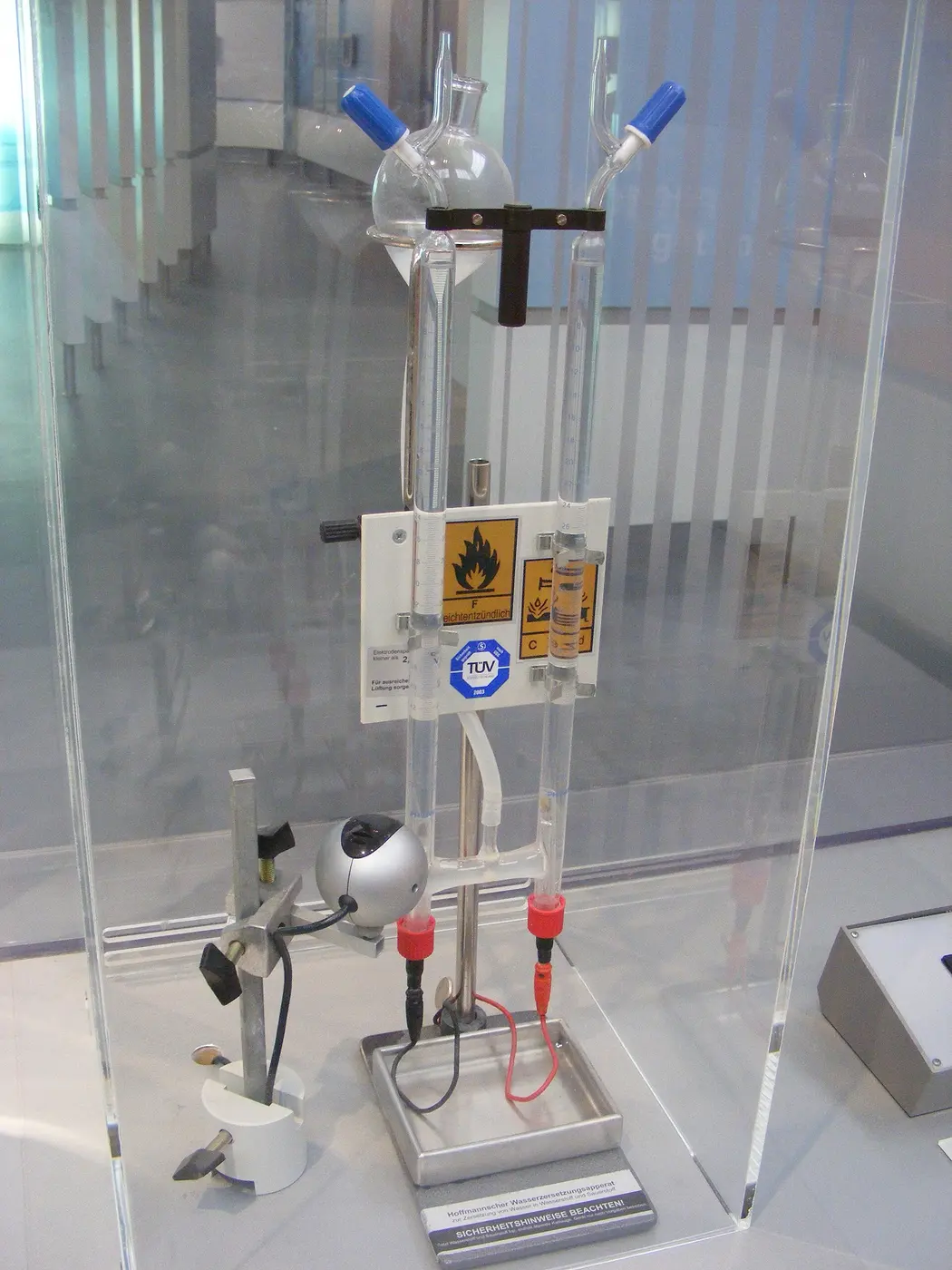An apparatus of connected glass tubes inside a transparent display case