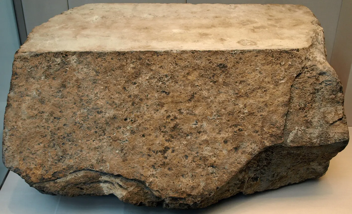 A large block of limestone with a whitish surface