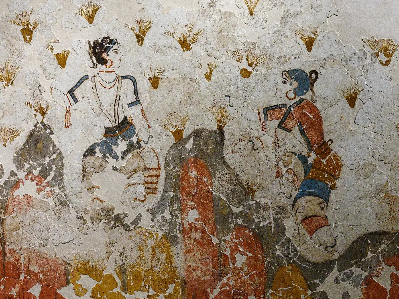 A cracked ancient wall painting of women picking flowers growing among rocks