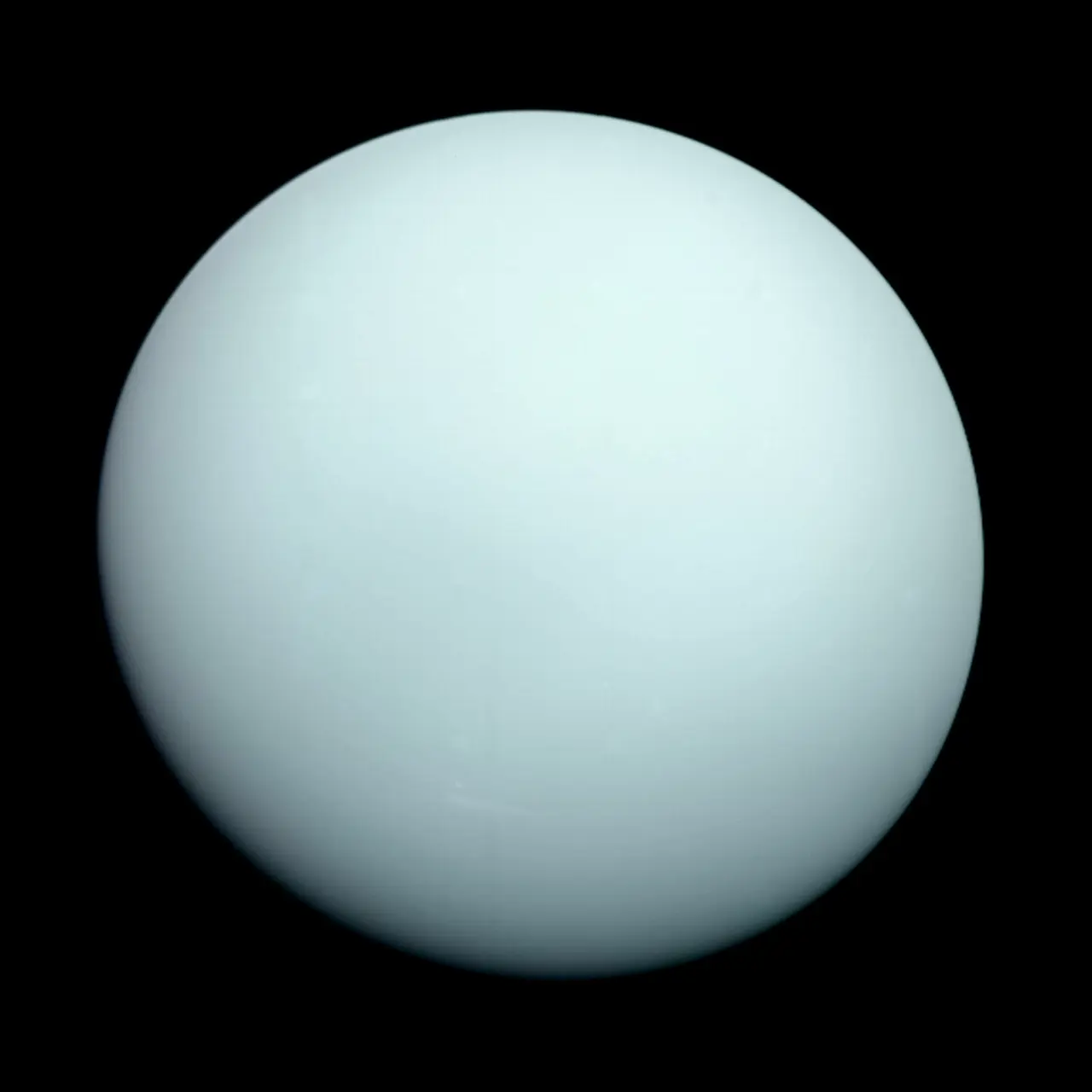 A nearly featureless blue-green Uranus floating against the black of space