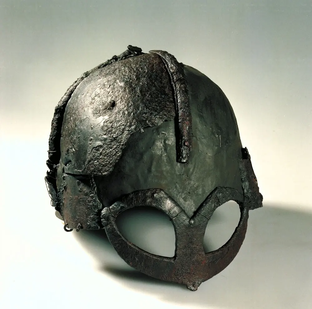 A hornless Viking Age helmet: a rounded iron cap with a spectacle-like guard around the eyes